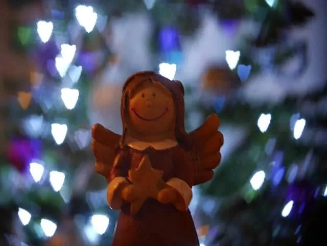 angel and christmas lights bokeh