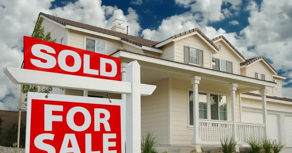 home with a for sale sign out front