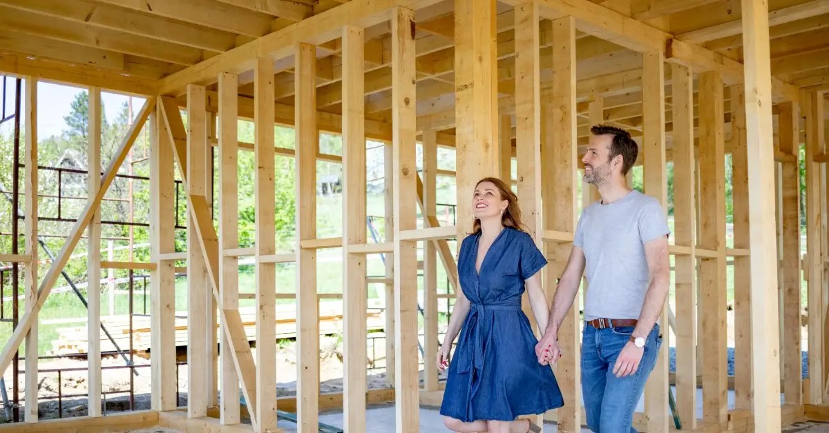 couple walking through a new construction home