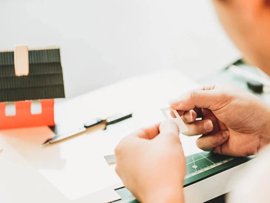 A person creating a house model