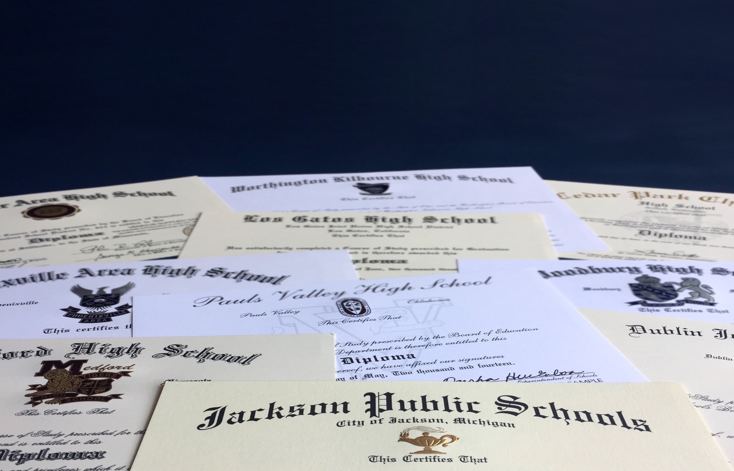 Photo of multiple diplomas scattered