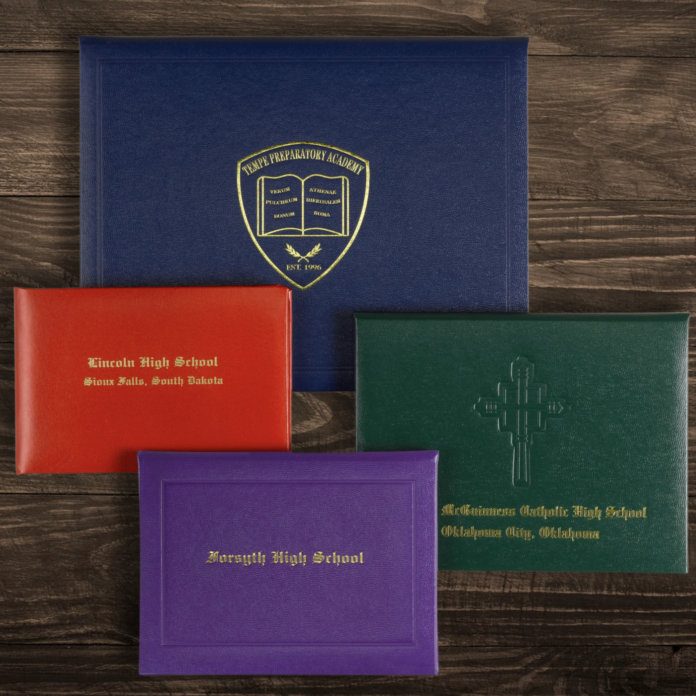 Diploma Covers on Wood Background