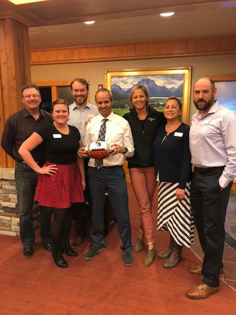 Broncs Backers First Interstate Bank share time with the 1981 State Champs ball.