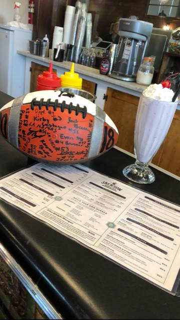 Broncs Backers Jackson Drug share time with the 1981 State Champs ball.