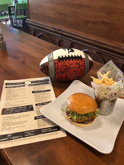Broncs Backers Liberty Burger share time with the 1981 State Champs ball.