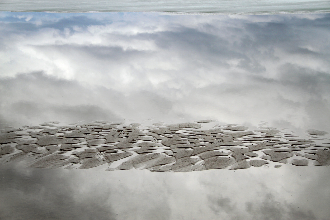 Calm After the Storm | A spring storm moves across the sky, reflected in the newly thawed water of Boulder Lake in Sublette County. Photo: Delsa Allen