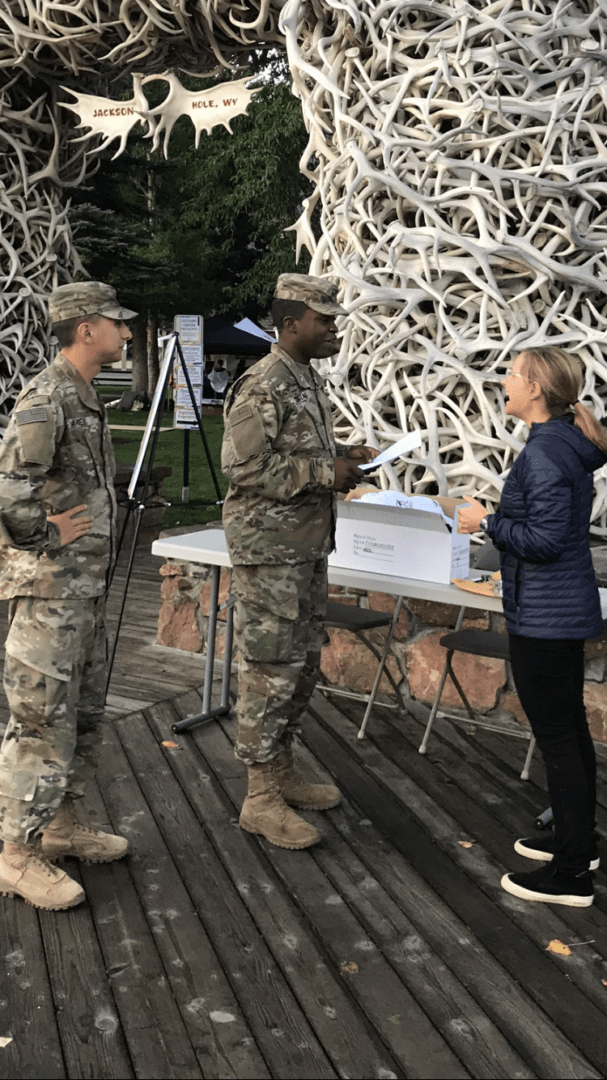 Corporal Devon Douglas, Ft. Carson BOSS President, and Sgt. Anthony Arens plan the day with Annie Ridell, Old Bill's fun run coordinator