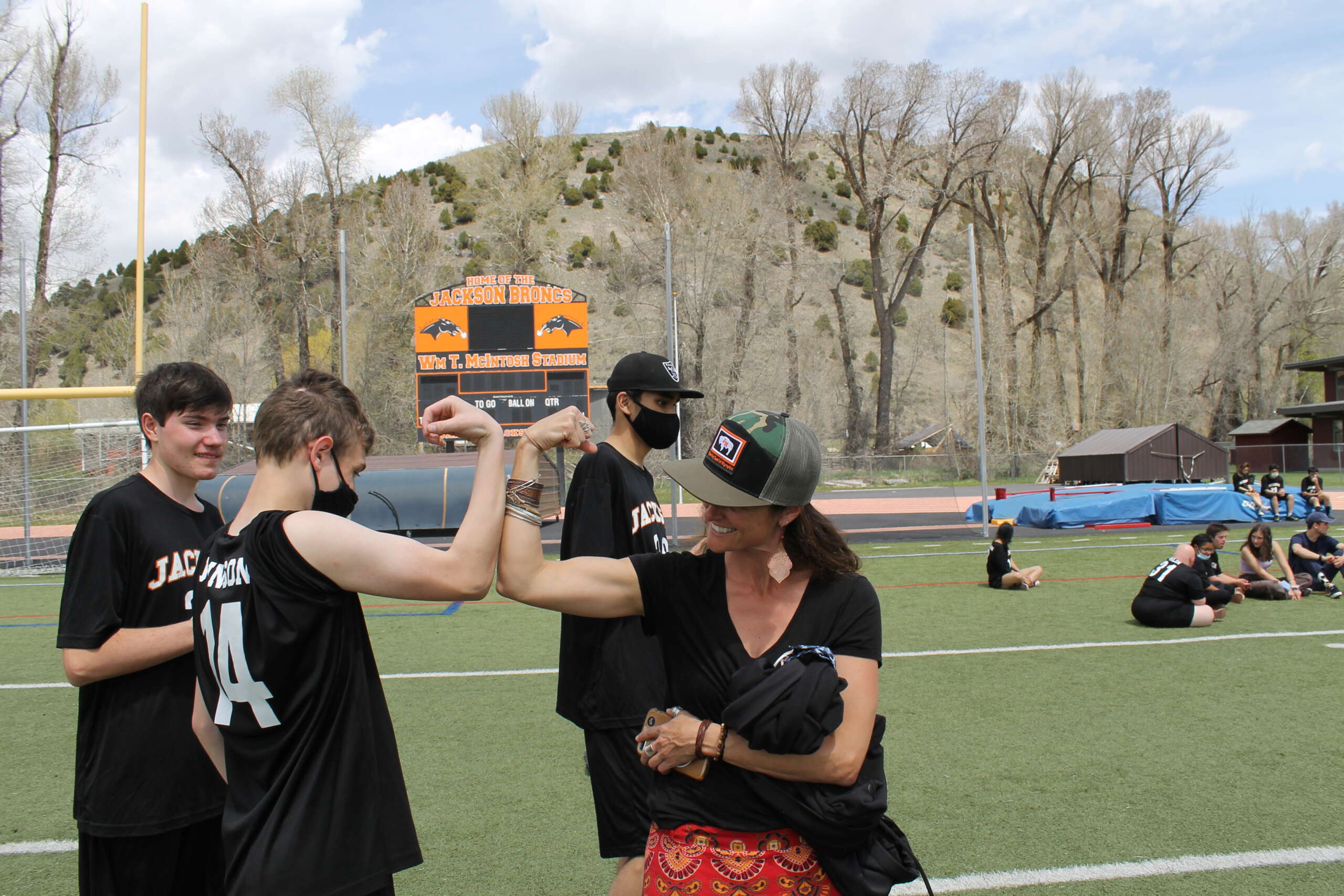 Kenner Johnson compares muscles with special education teacher, Morgane Boag after the soft ball throw competition. Photo: TCSD