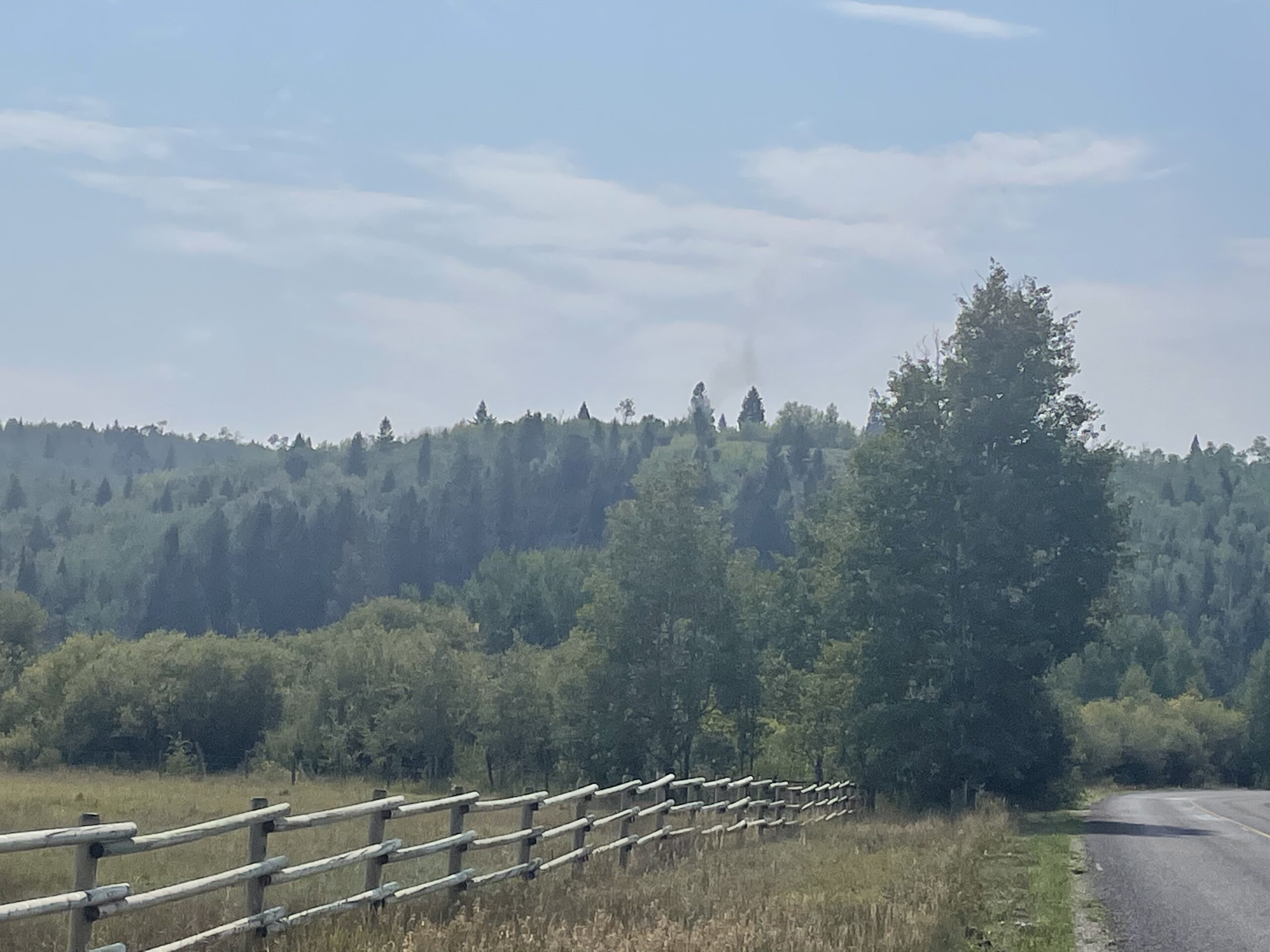 A small column of smoke can be seen from South Fall Creek Road. Photo: Buckrail