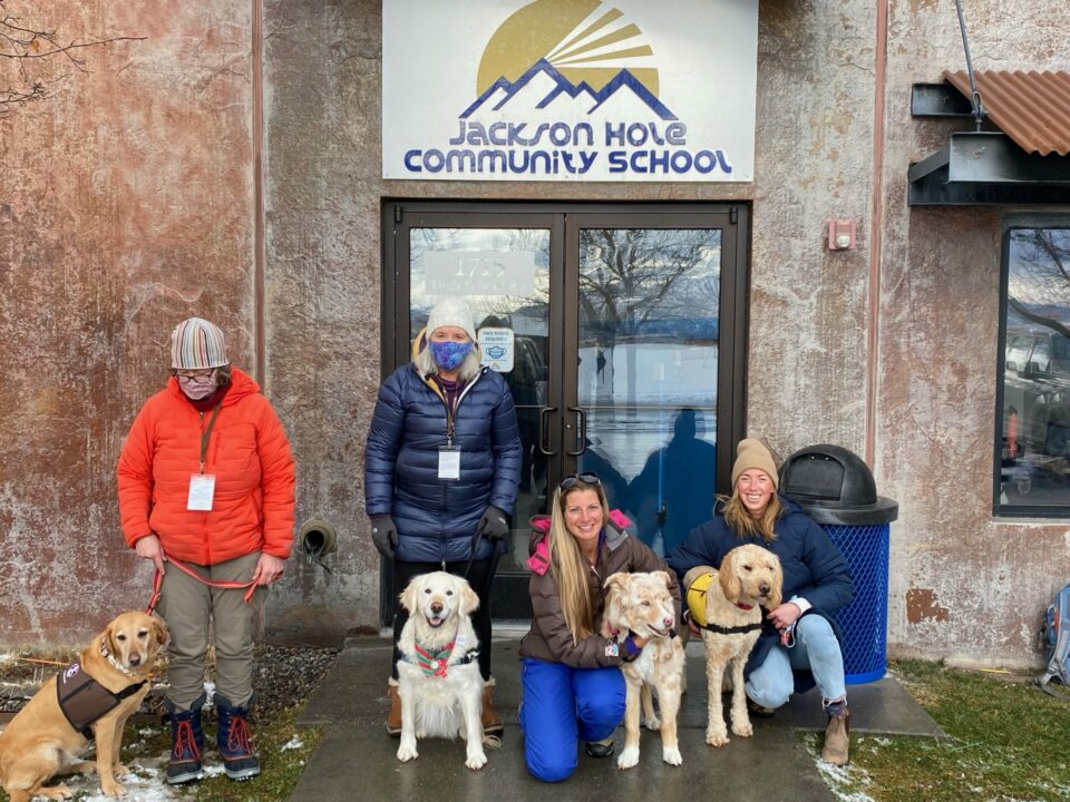 Dogs and their handlers, from left to right: Tellie and Laura, Hazel and Martha, Quincy and Megan, Louis and Fan. Photo: Kelly Chadwick
