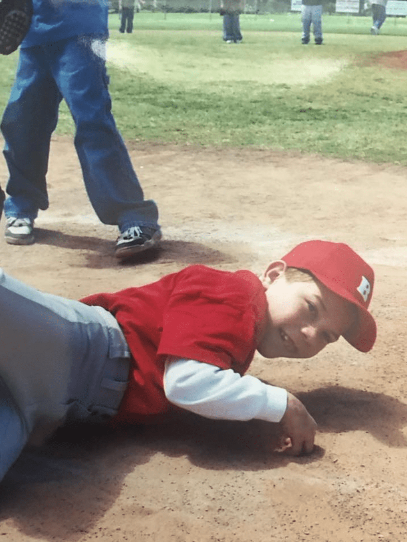 Young Ben sliding into home plate