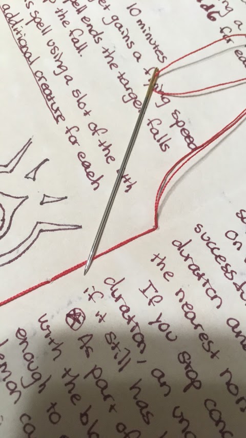 close up of sewing the signatures together