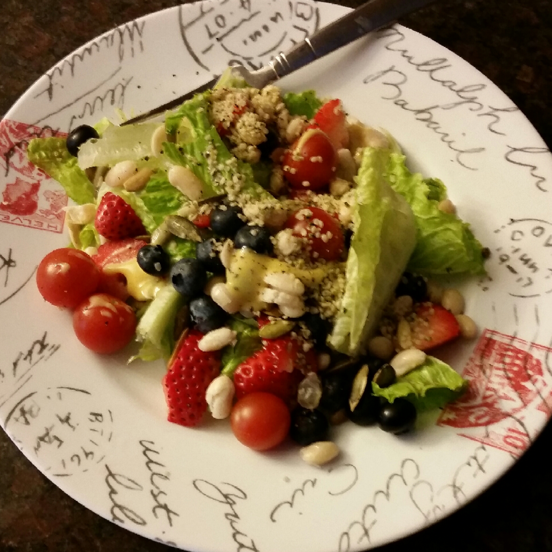 Taste of summer in January :) cherry tomatoes, sunflower seeds strawberries, blueberries great northern beans topped with hemp seed and honey mustard dressing.