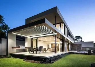 Energy-efficient modern home designed by top builders in Kerala with natural lighting and smart architectural planning