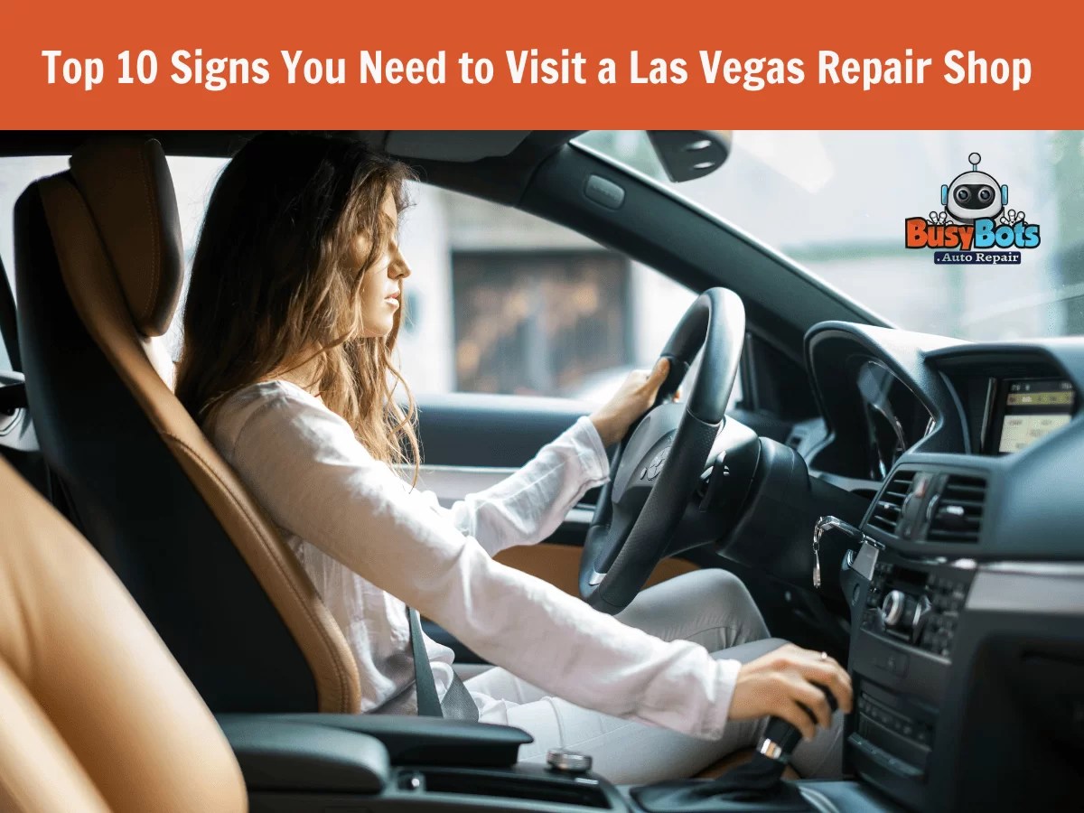 Person driving a car, focusing on the steering wheel and dashboard, with a text overlay about signs to visit an auto repair shop.