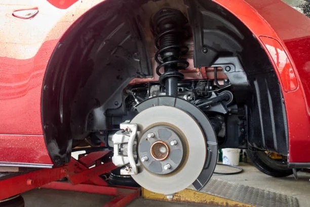Expert mechanic performing vehicle diagnostics
