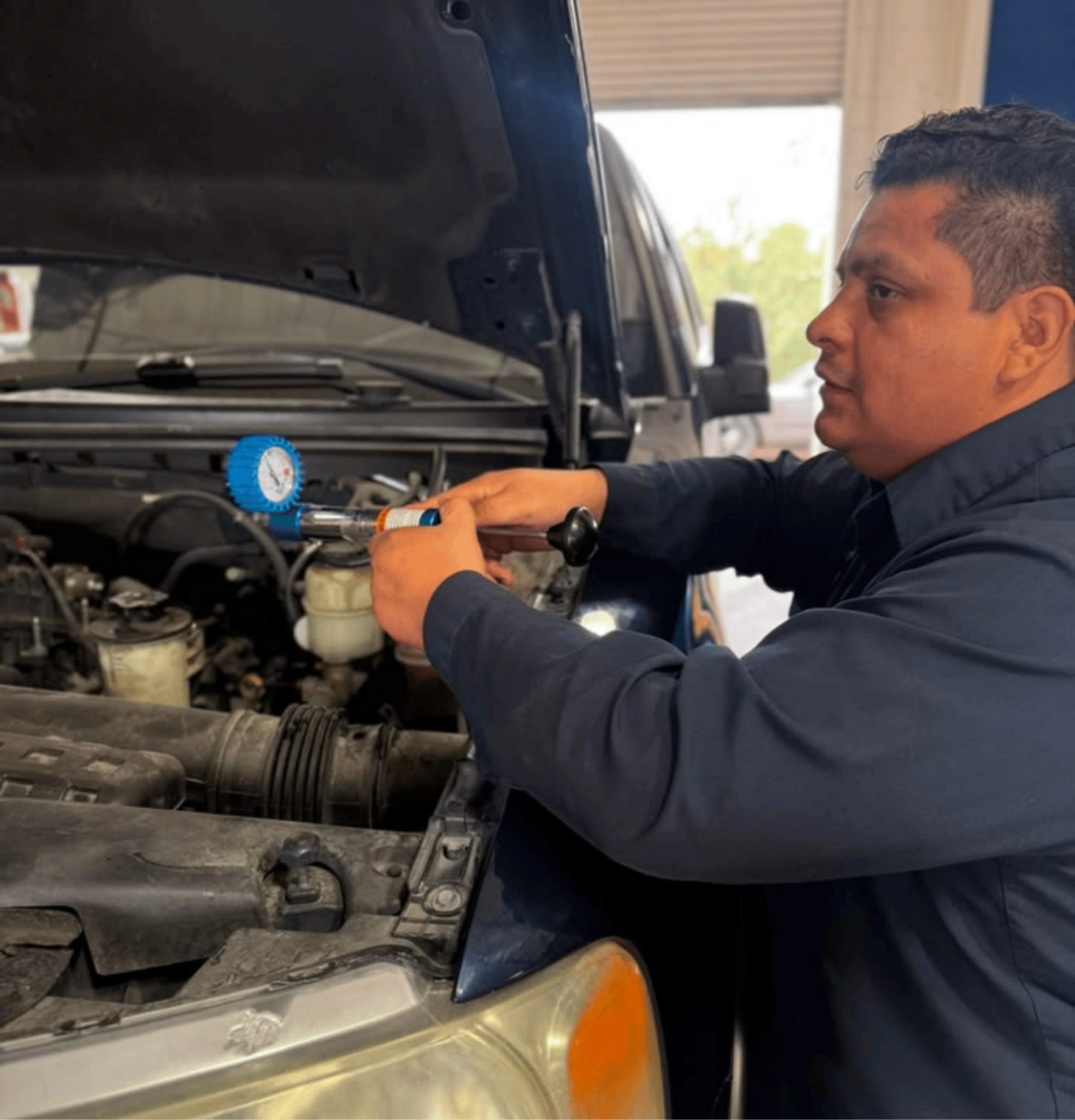 Busy Bots technician diagnosing an automotive cooling-system problem
