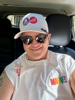 Color image of ButchOnTap in logo baseball cap and white Marvel t-shirt