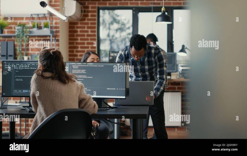 Developer Coding In An Office With Multiple Screens Displaying Data - Vintage Wallpapers - Professional Ultra HD Collection