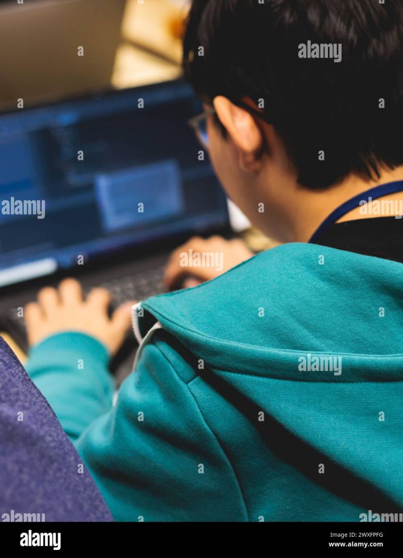 Software Developer Students In Auditorium Hall Working On Computer And Laptop Programming - Artistic Dark Background - 4K