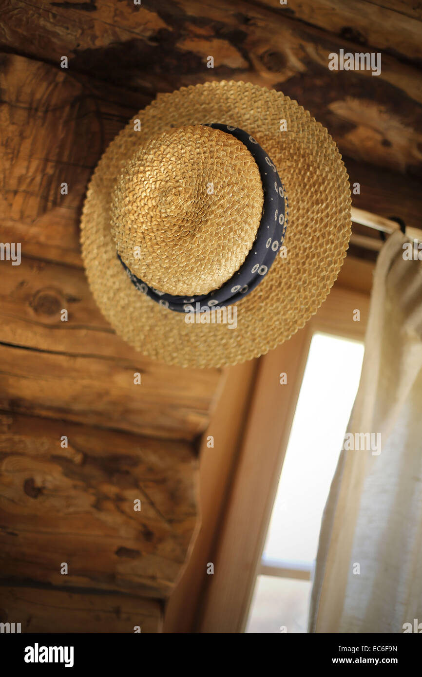 Straw hat window stock photo