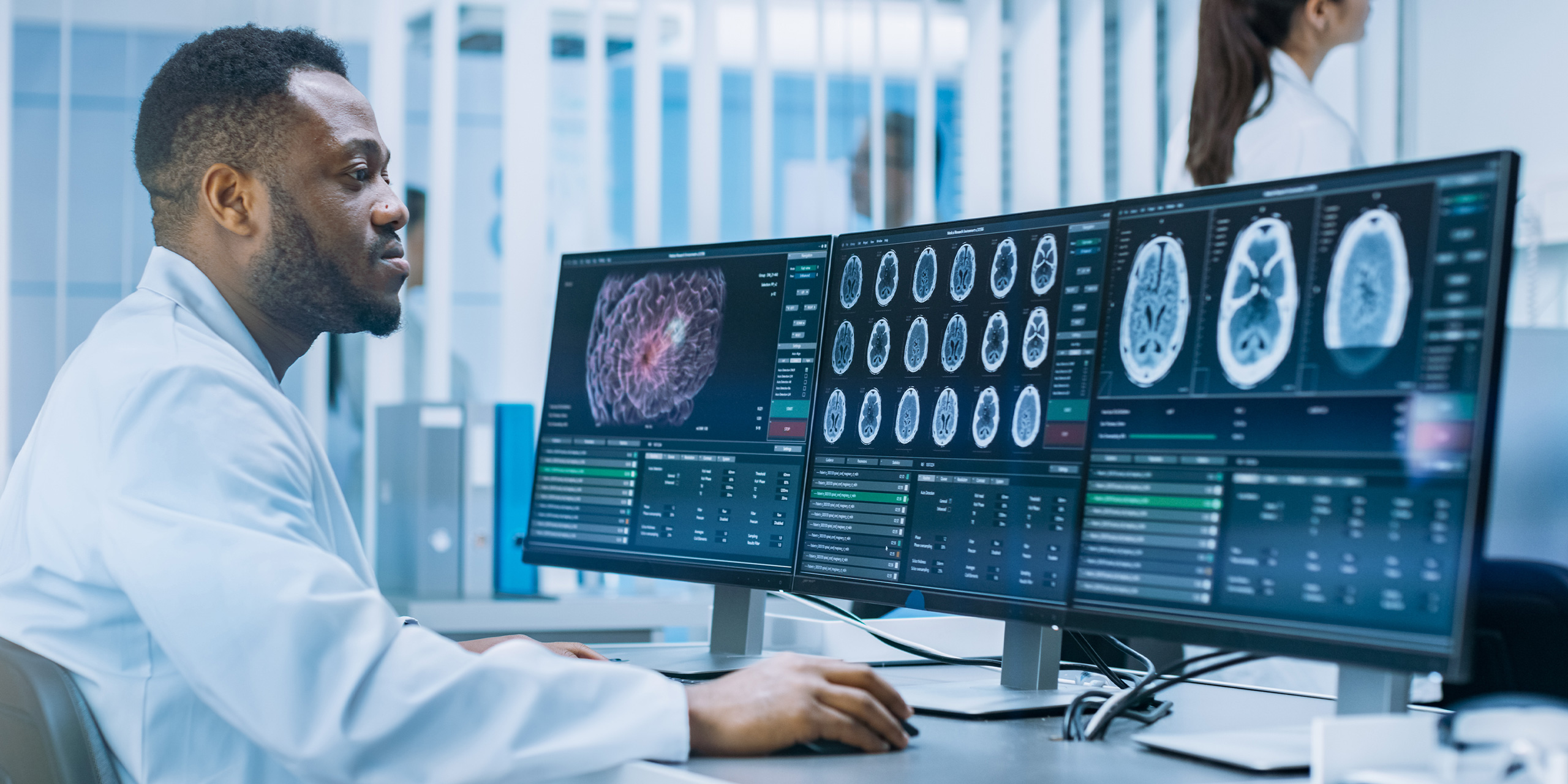 A doctor looking at brain scans.