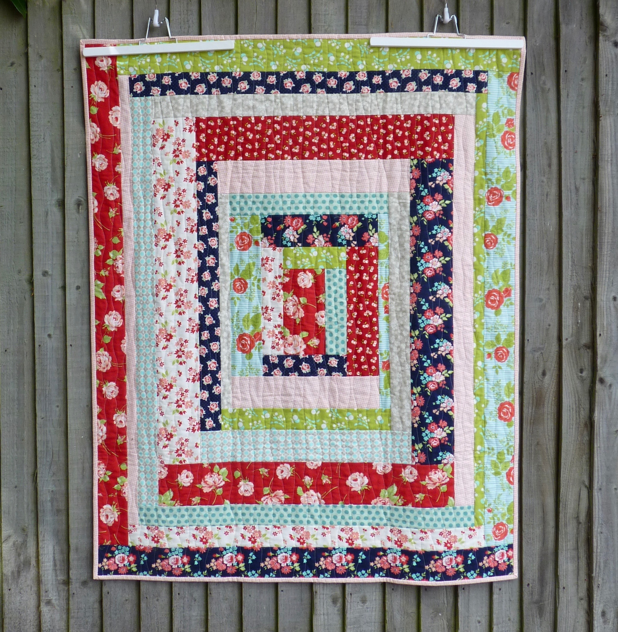 Modern vintage giant log cabin quilt