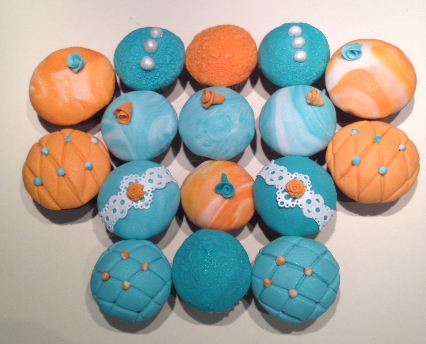 Orange and jade cupcakes