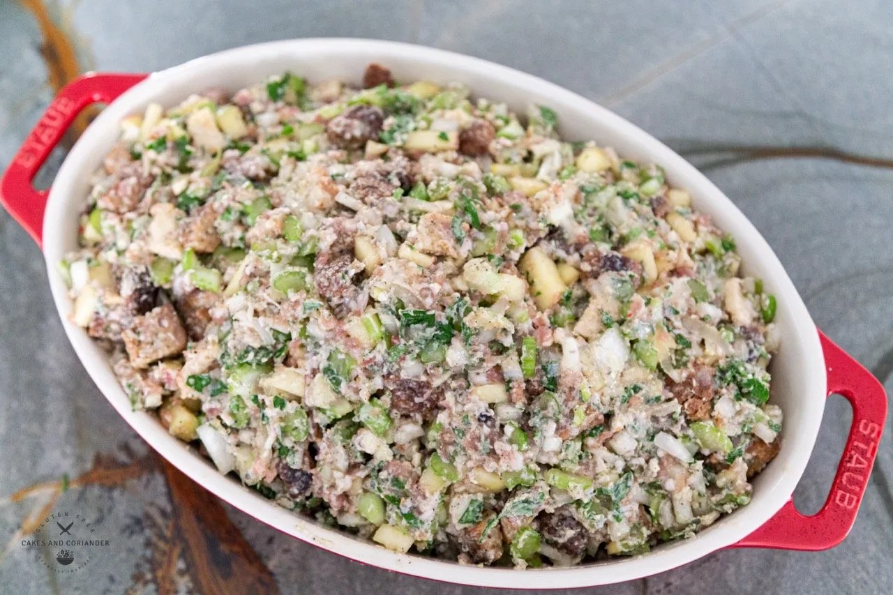 Uncooked gluten free stuffing with croutons, apples, and sausage
