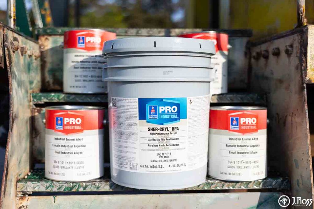 Close-up of Sherwin-Williams Sher-Cryl HPA and Industrial Enamel Alkyd paint chosen for the caboose restoration