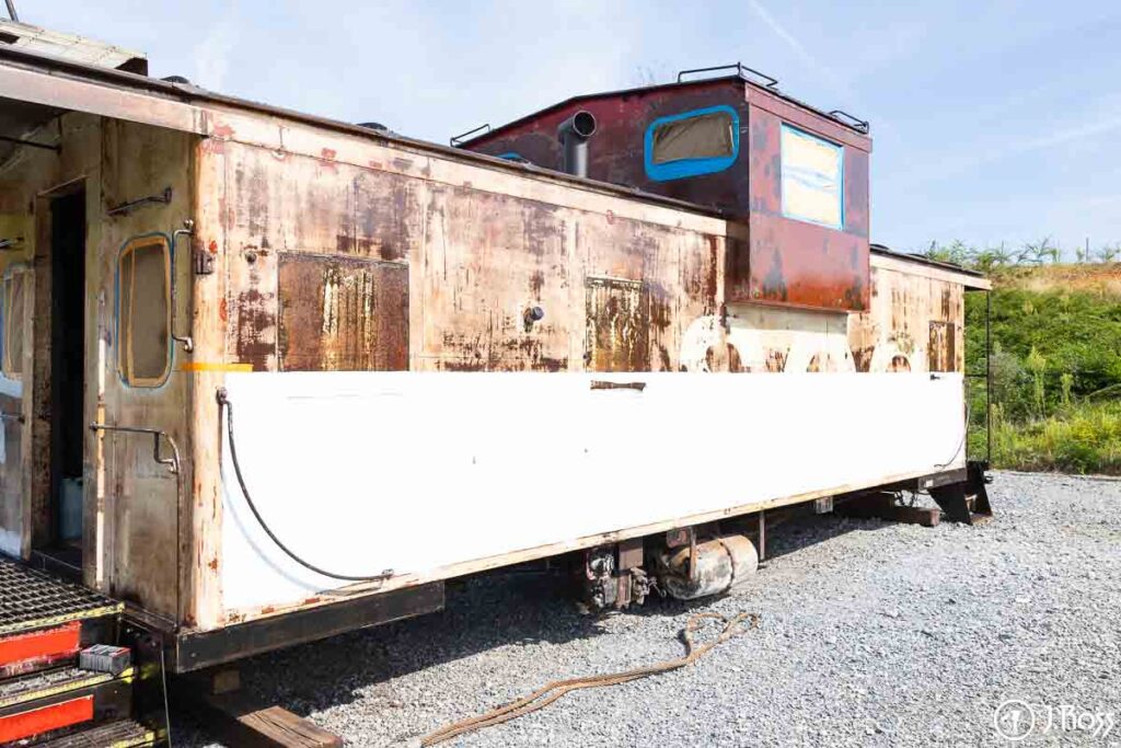 Historic SOO Line caboose taped off and ready for the white stripe to be painted