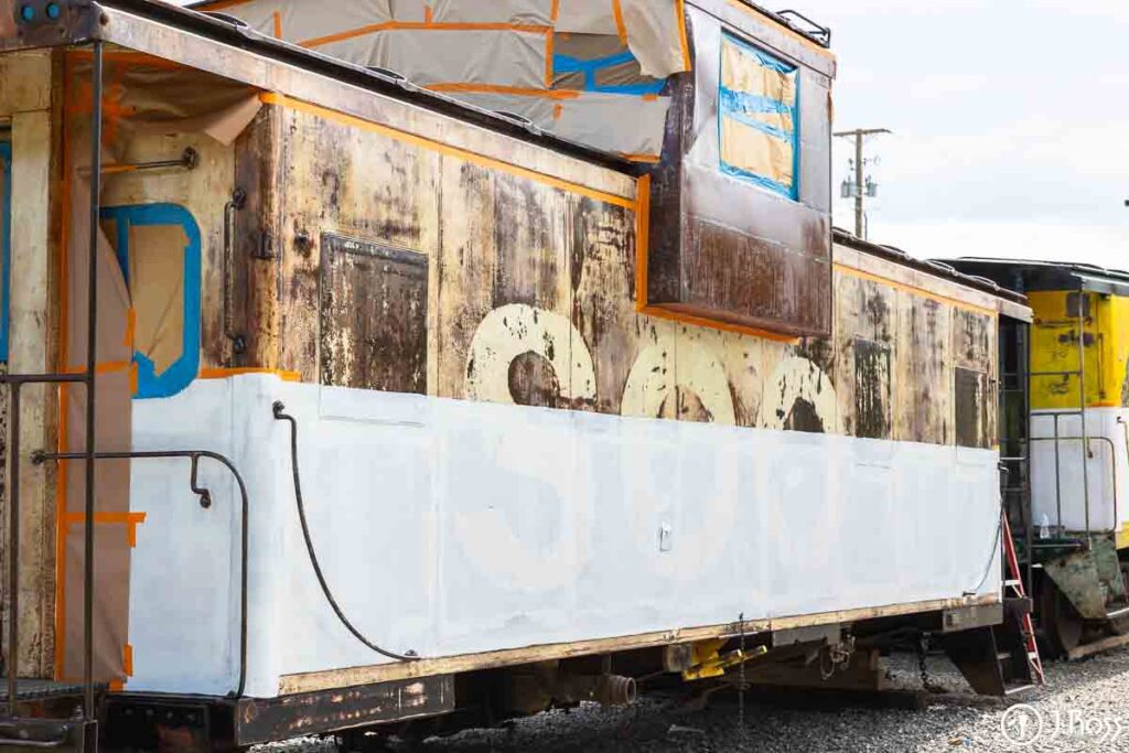 Side view of train caboose after the first coat of paint in Kingsport