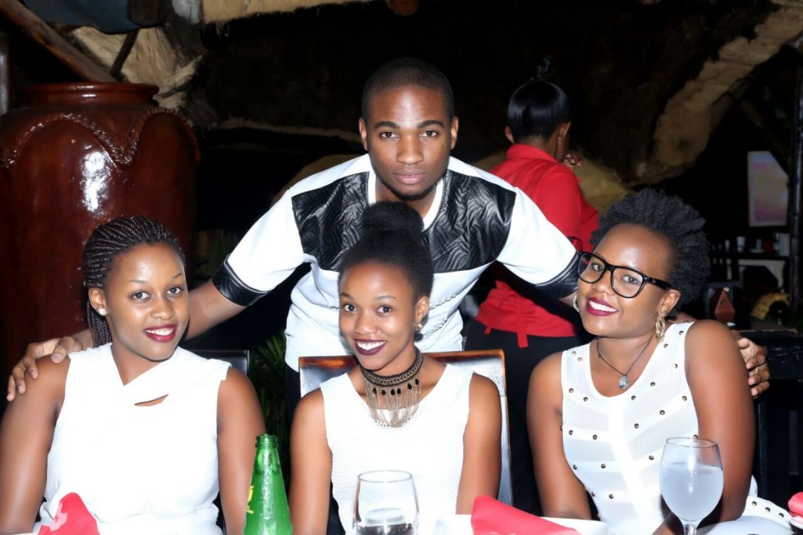 The birthday boy with the pretty ladies in white