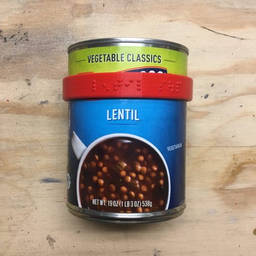 Progresso lentil soup can wearing a CanDo braille label