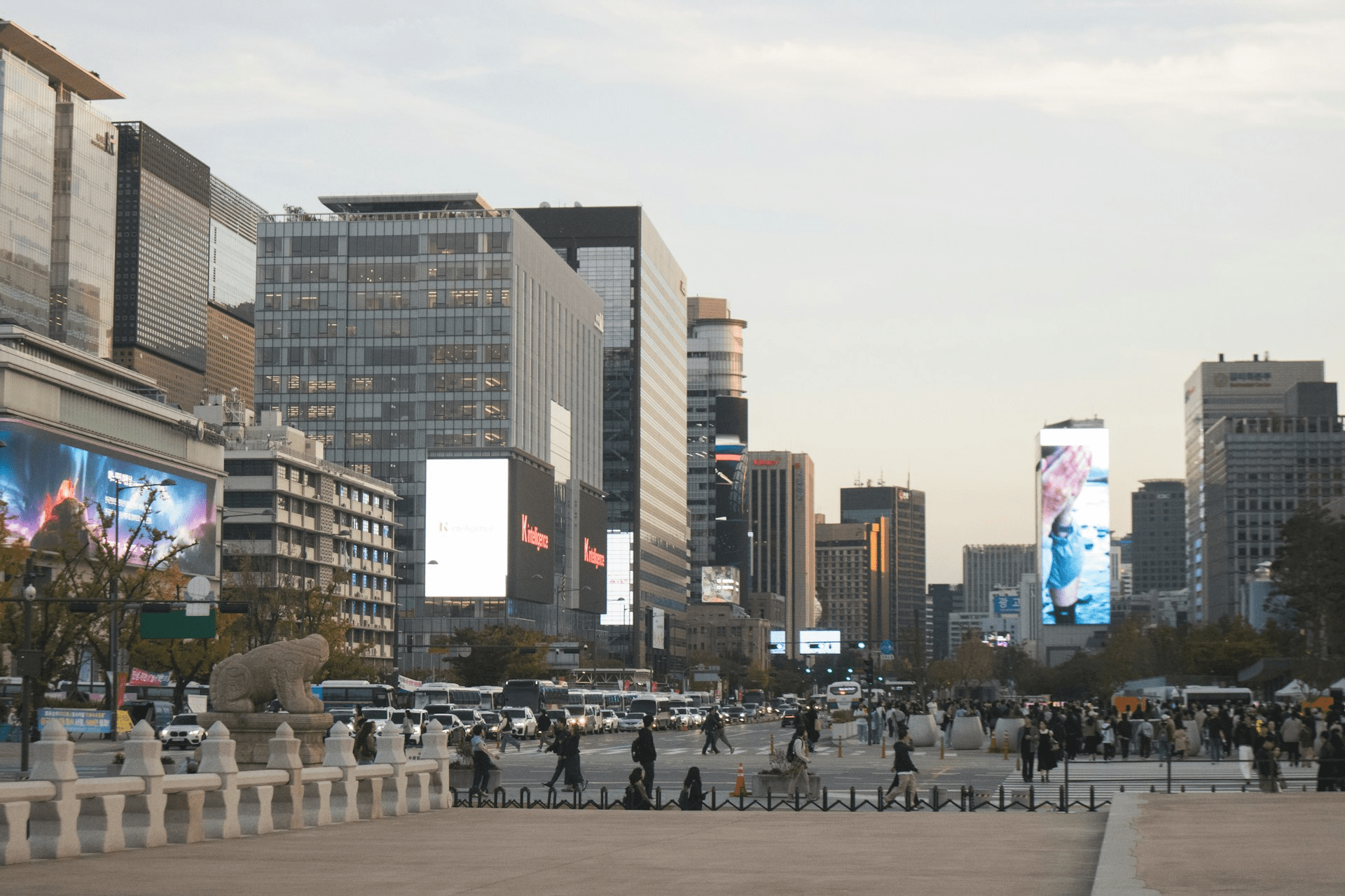 City street in Seoul with tall buildings and digital billboards