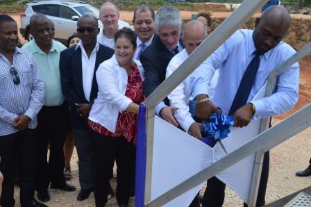 Minister of Energy Science & Technology Andrew Wheatley cutting the ribbon last August. (Photo: Canadian High Commission)