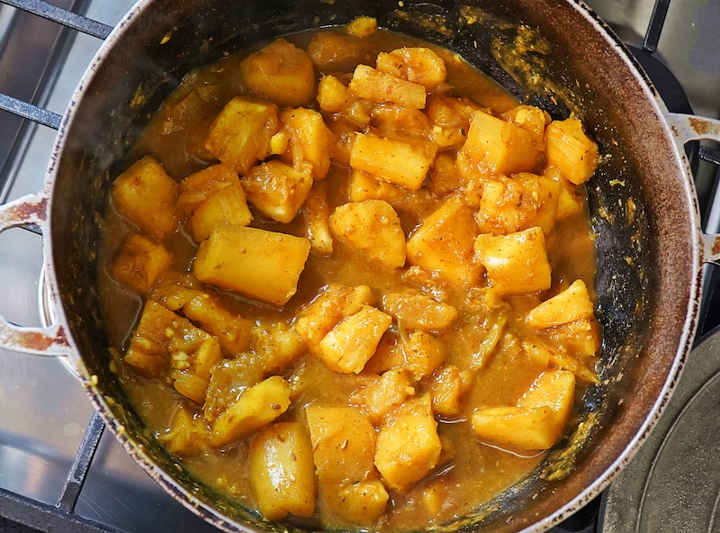 Curry Cassava in a large silver pot
