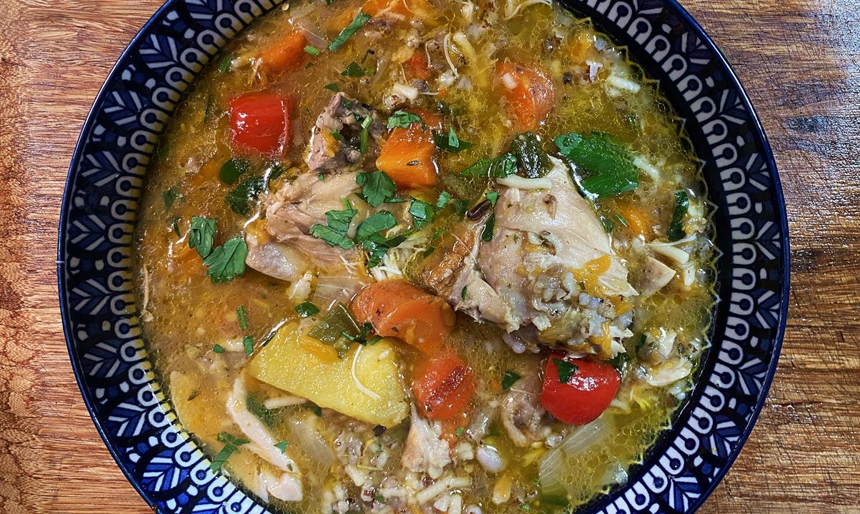 Roasted Chicken With Moruga Hill Rice Soup in a beautiful blue bowl