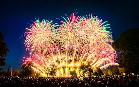 Thousands of people watch a fireworks display, as the UK's finest fireworks companies compete during the Fireworks Champions at Newby Hall in Yorkshire