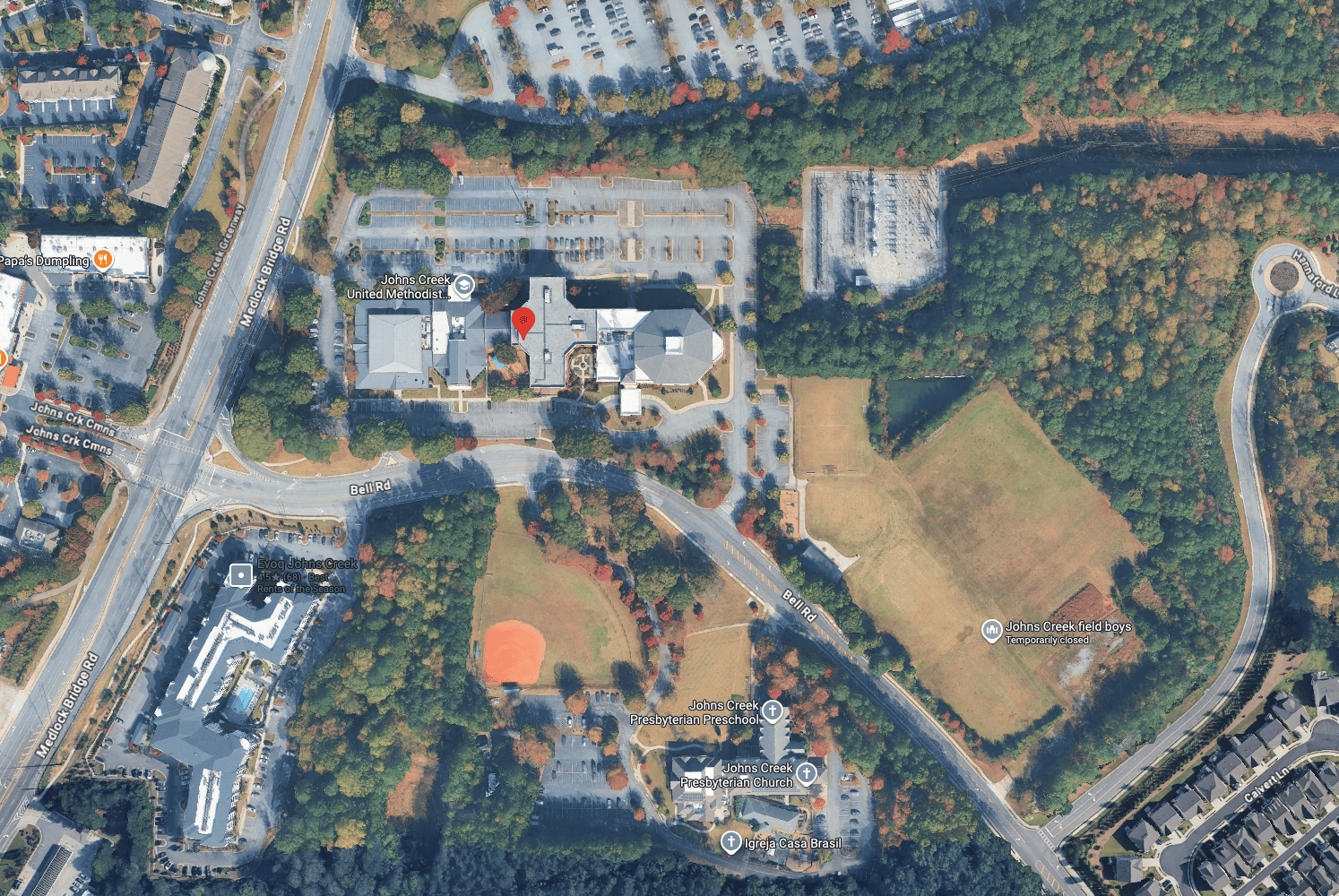 Aerial overview of Johns Creek United Methodist Church and the eastern grounds