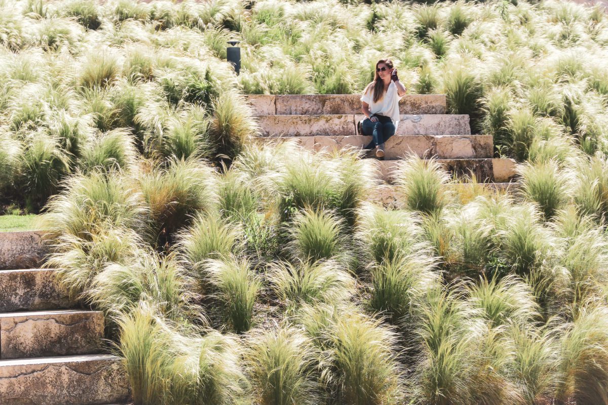 girl sitting in OKC at Myriad Gardens