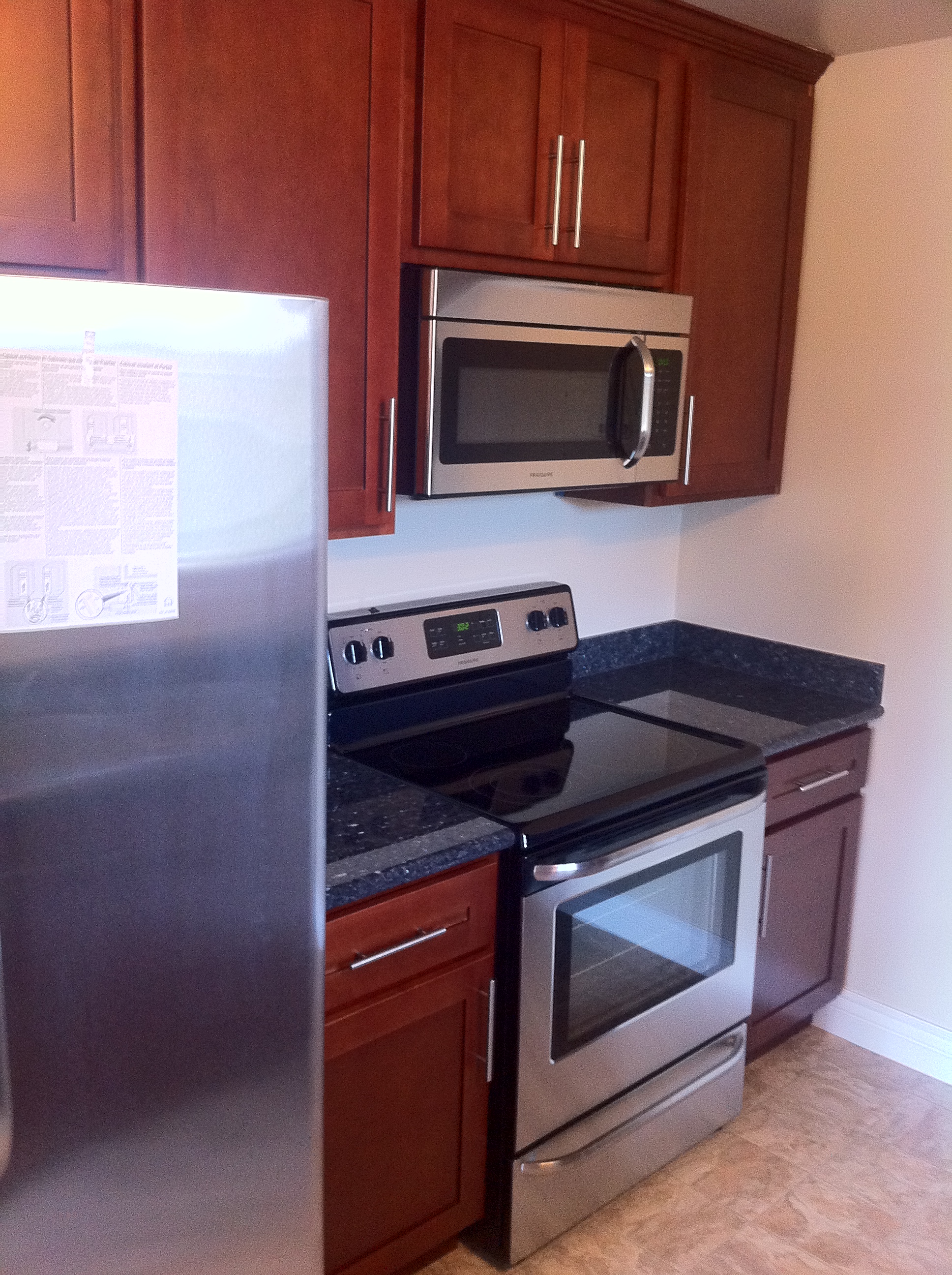 Remodeled kitchen with granite counters, stainless steel appliances