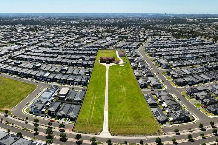 Large suburban housing development showing land supply and construction demand pressures in Australia