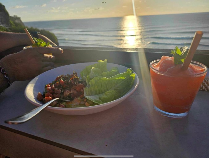 Food in front of the sunset at Uluwatu. 