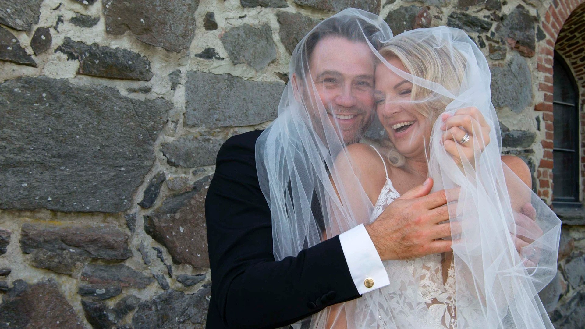 Wedding couple under veil