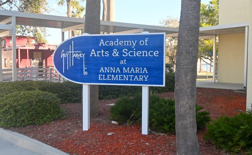 An image of the sign for Guy Harvey Academy of Arts and Sciences at Anna Maria Elementary School