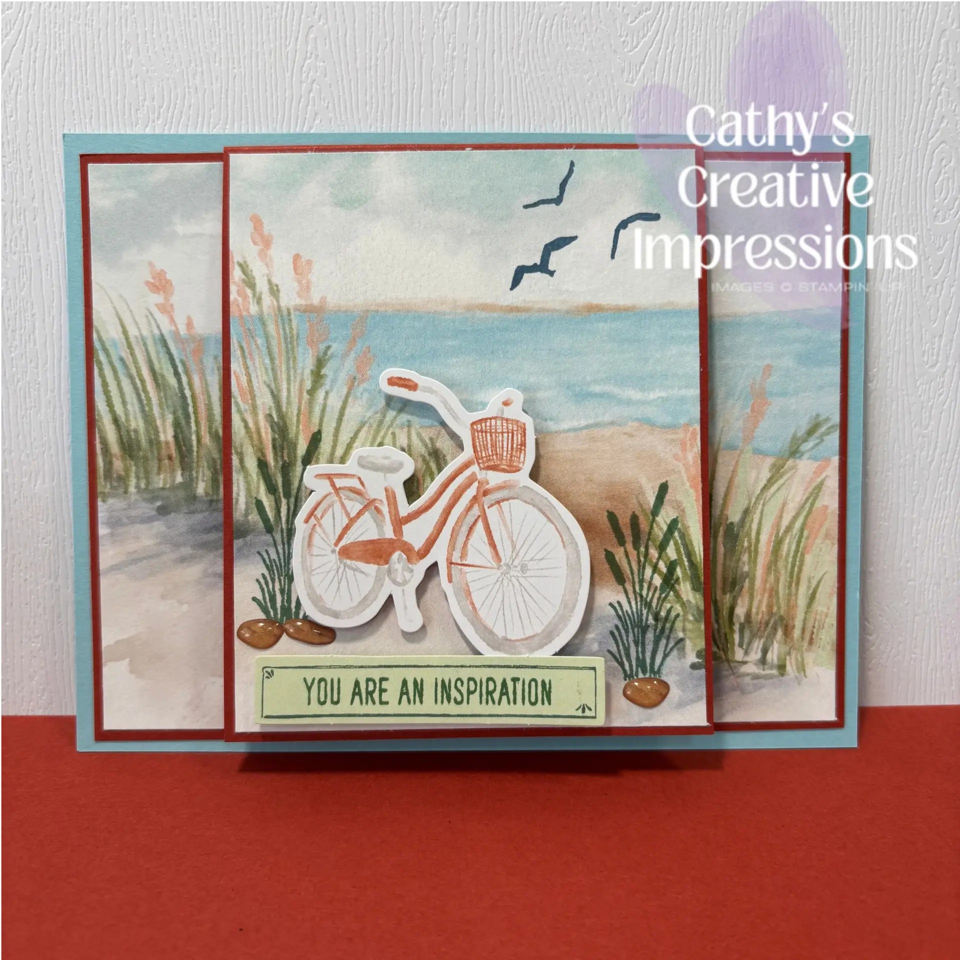 Waterside Inspiration Fun Fold Card made using the Stampin' Up! Waterside Retreat Suite Collection and Lakeside Retreat Paper Pumpkin Kit elements. Fun Fold design adds interest with bicycle focal image in foreground against lake or seaside background.