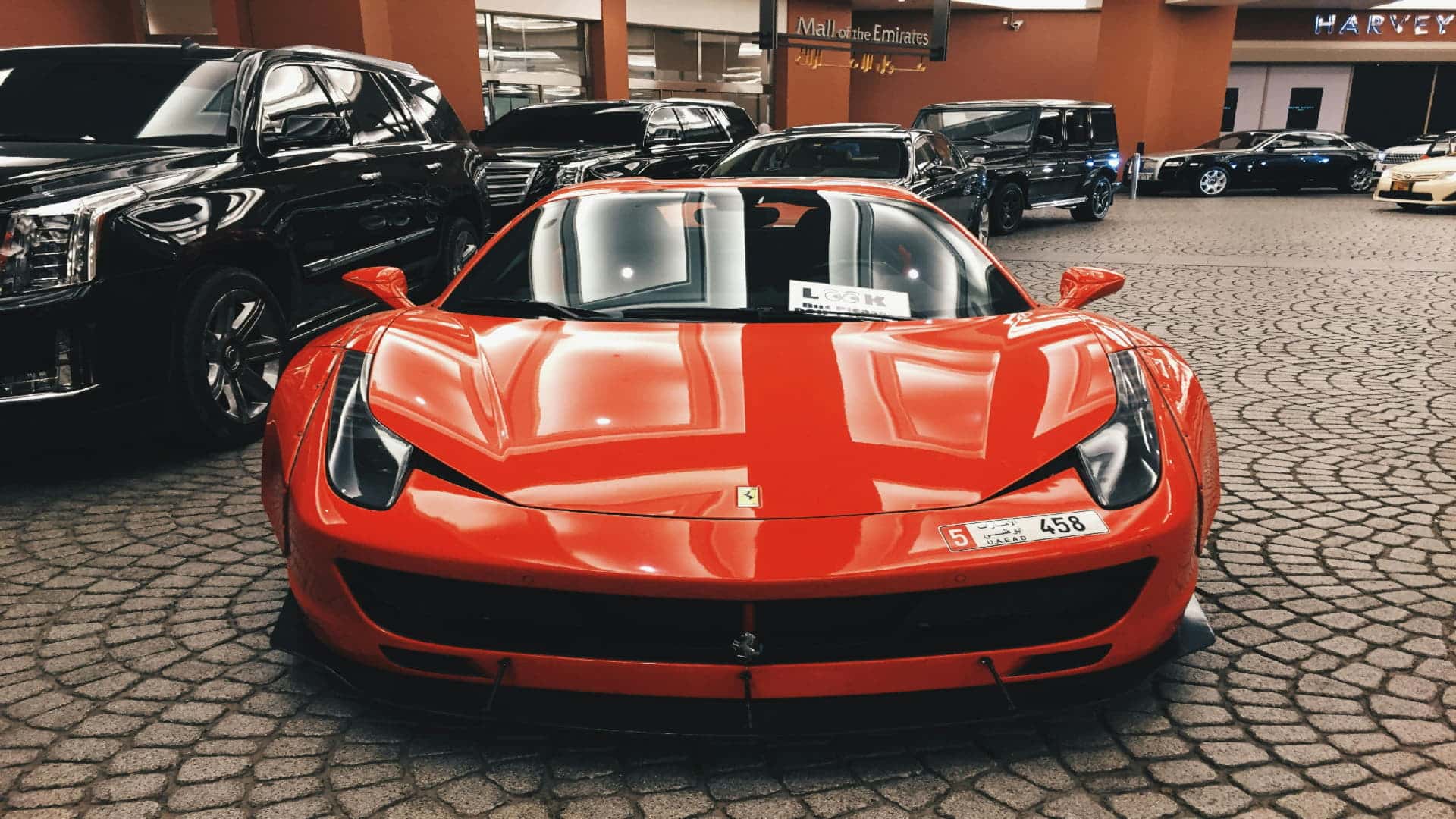 Luxury red Ferrari showcased, highlighting best place to get catalytic converter replaced