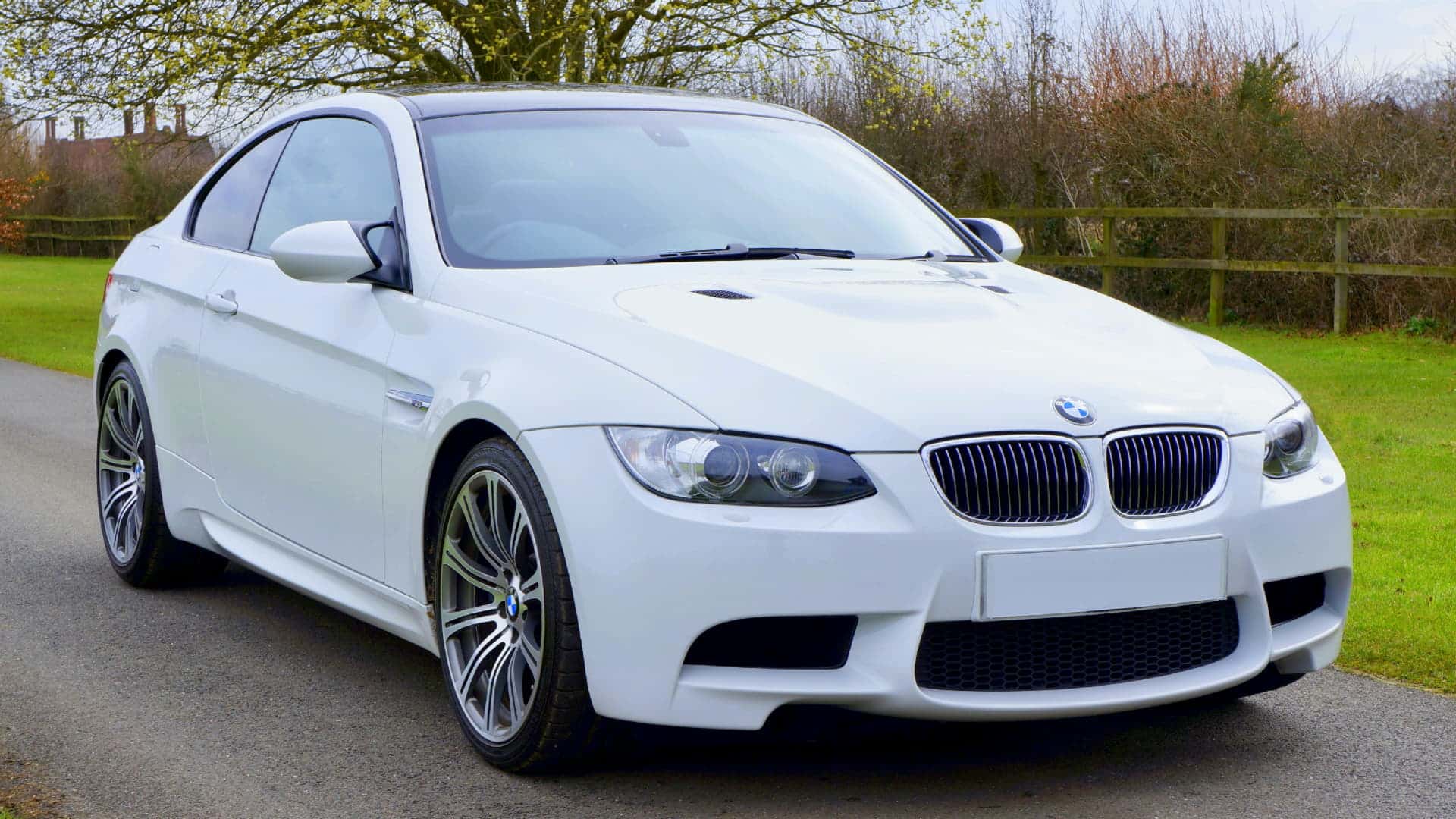 White BMW car parked outdoors for repair catalytic converter near me
