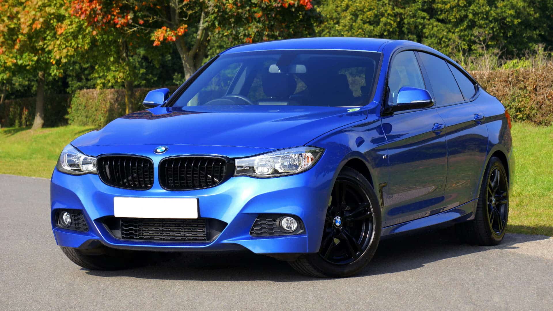 Blue BMW sedan parked outdoors, ideal for catman website targeting catalytic converter buyers near me